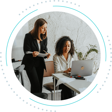 Two business women working together
