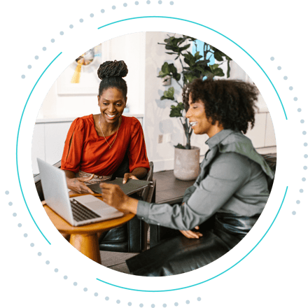 Two business women working together