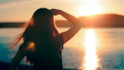 person looking out at large body of water